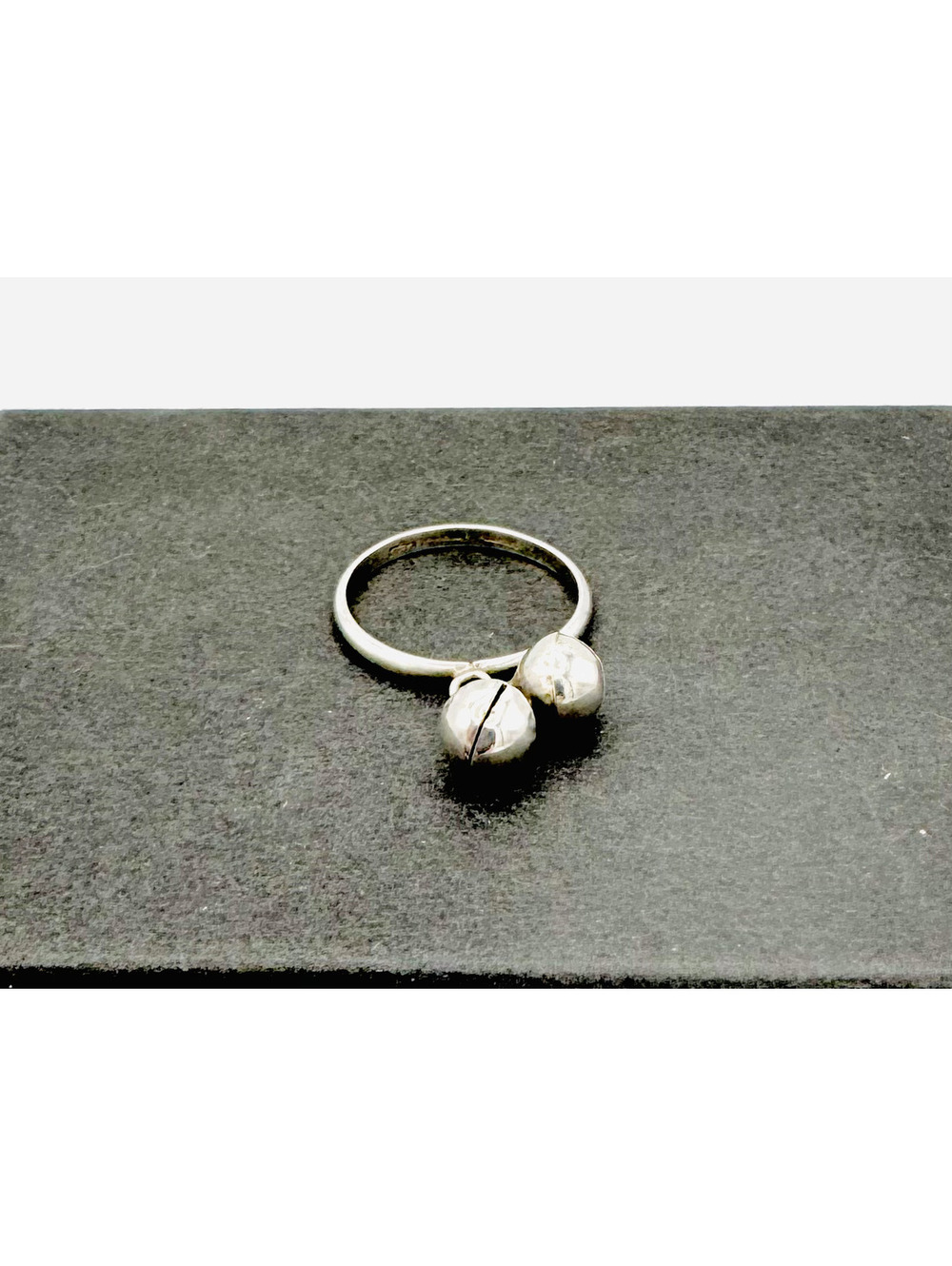 Sterling silver band ring with 2 ringing bell type beads